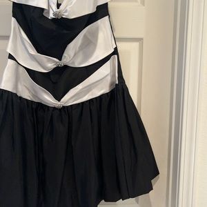 Dress/Black and White with bows and rhinestones in the front.